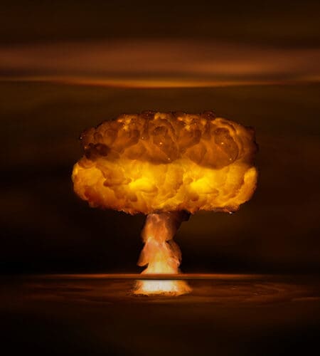 What is a nuclear reaction in which two small atomic nuclei fuse called in scientific terms?