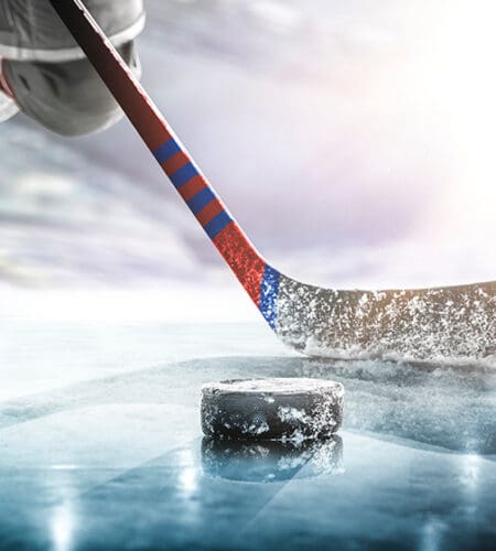 Hockey pucks travel at speeds of up to how many miles an hour?
