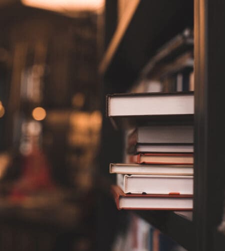 What writer graduated Valley Forge Military Academy before working as a cruise ship entertainer?