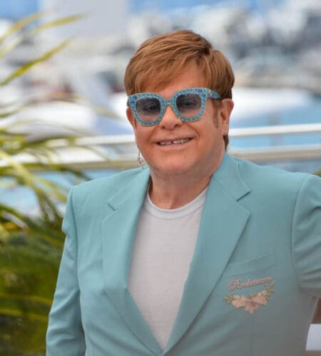 Which Elton John song tells the story of a fictional band with a flamboyant female lead singer?