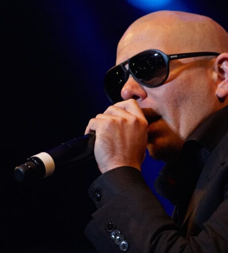 What 2014 Pitbull hit song features songwriter and producer John Ryan?